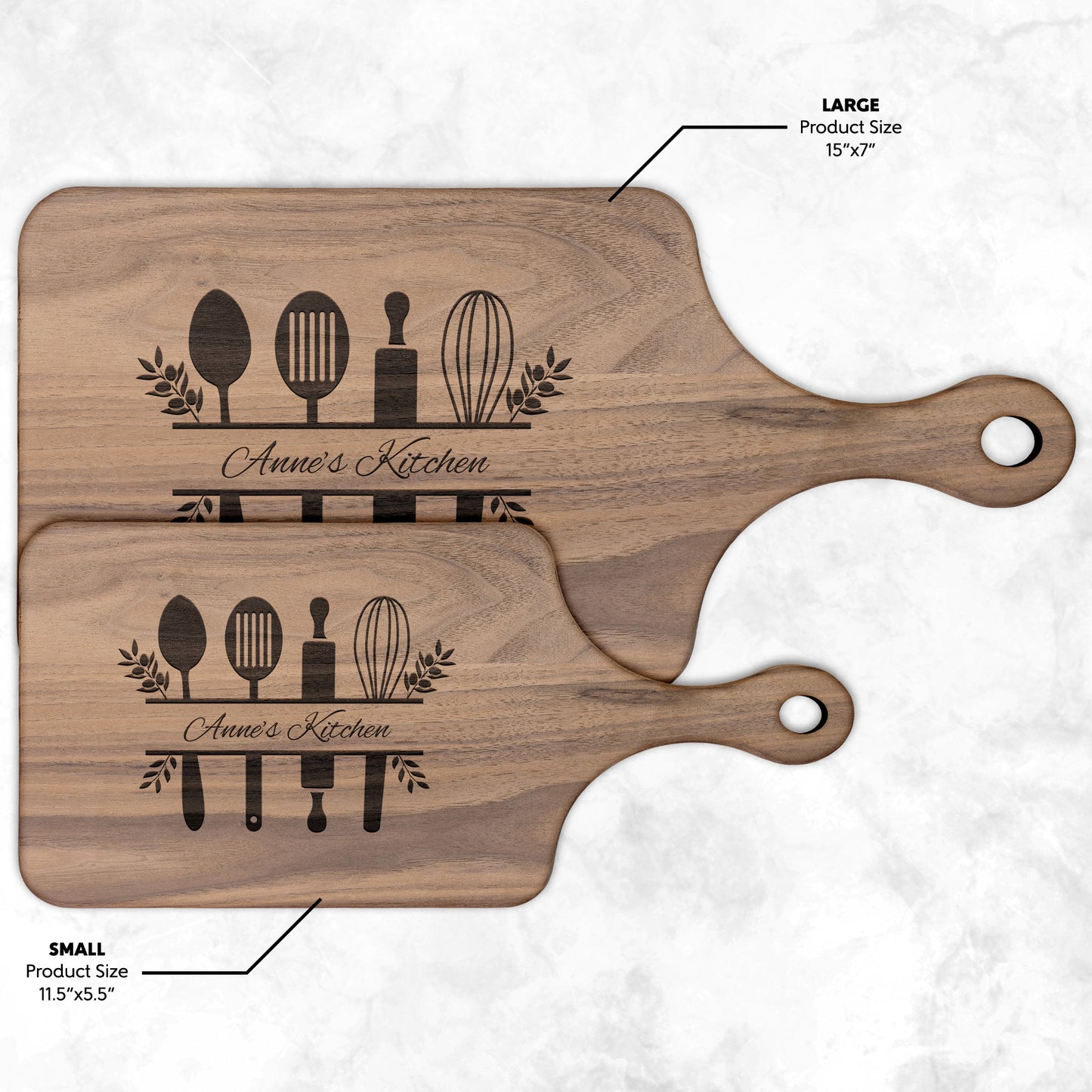view of two different sized personalized walnut paddle cutting board on a white background