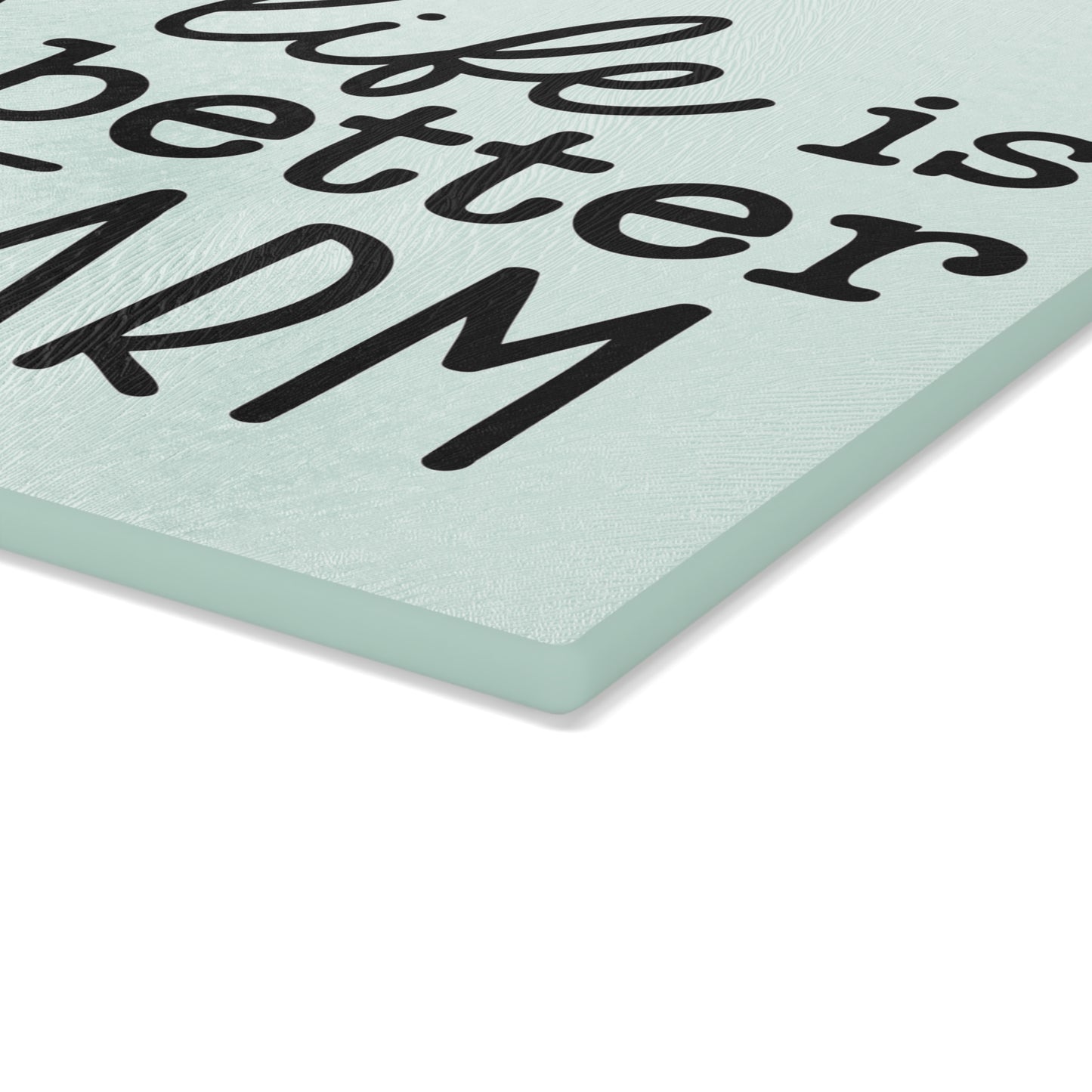 close view of the thickness of a glass cutting board