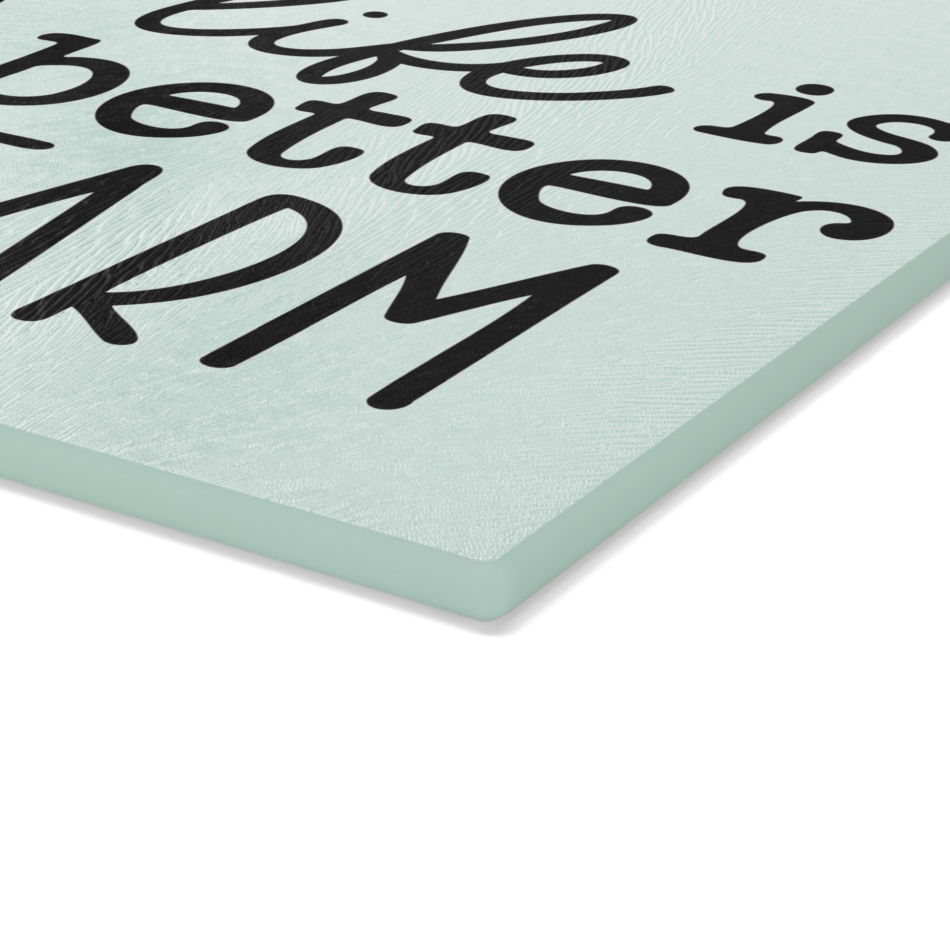 close view of the thickness of a glass cutting board