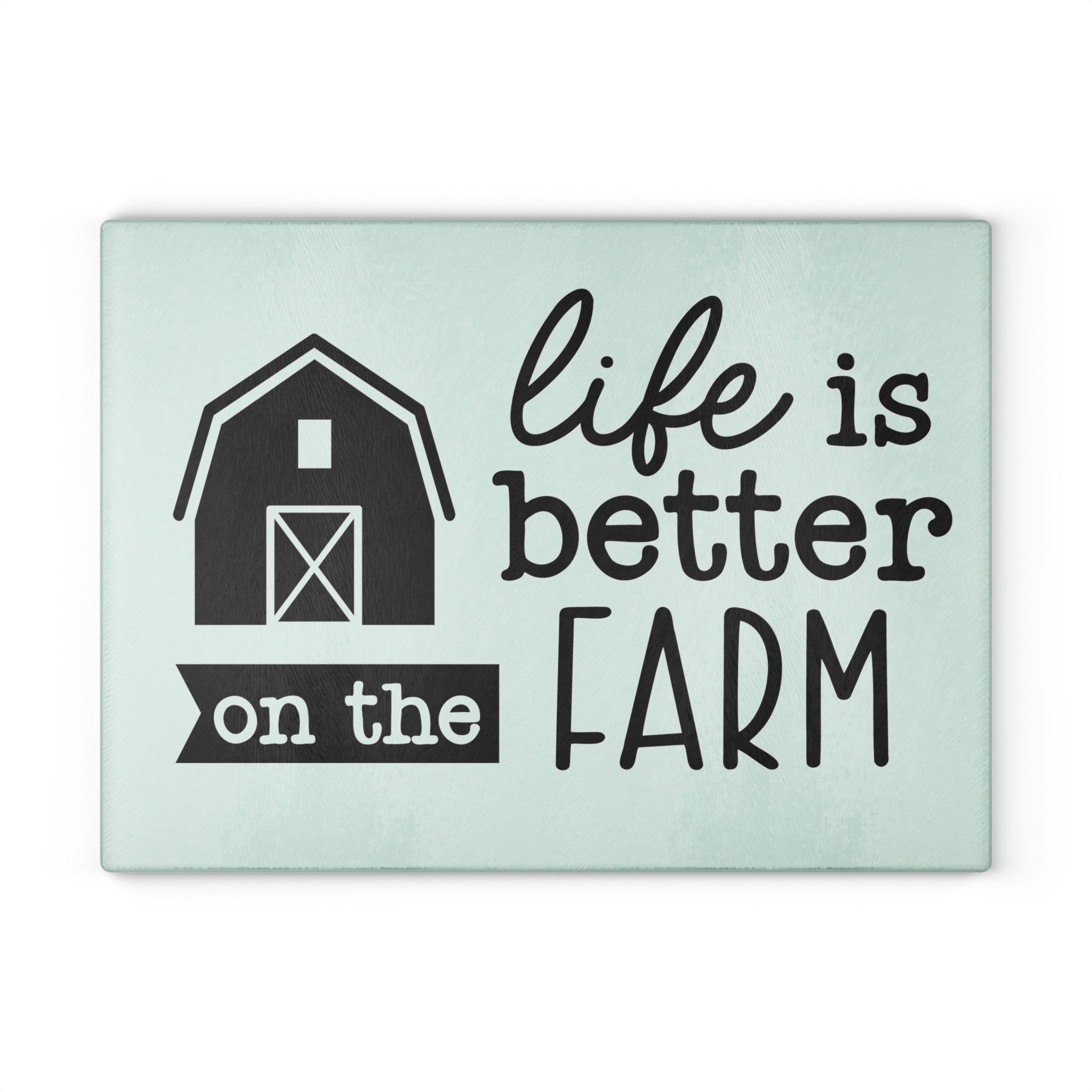 glass cutting board with the words "life is better on the farm" on a white background