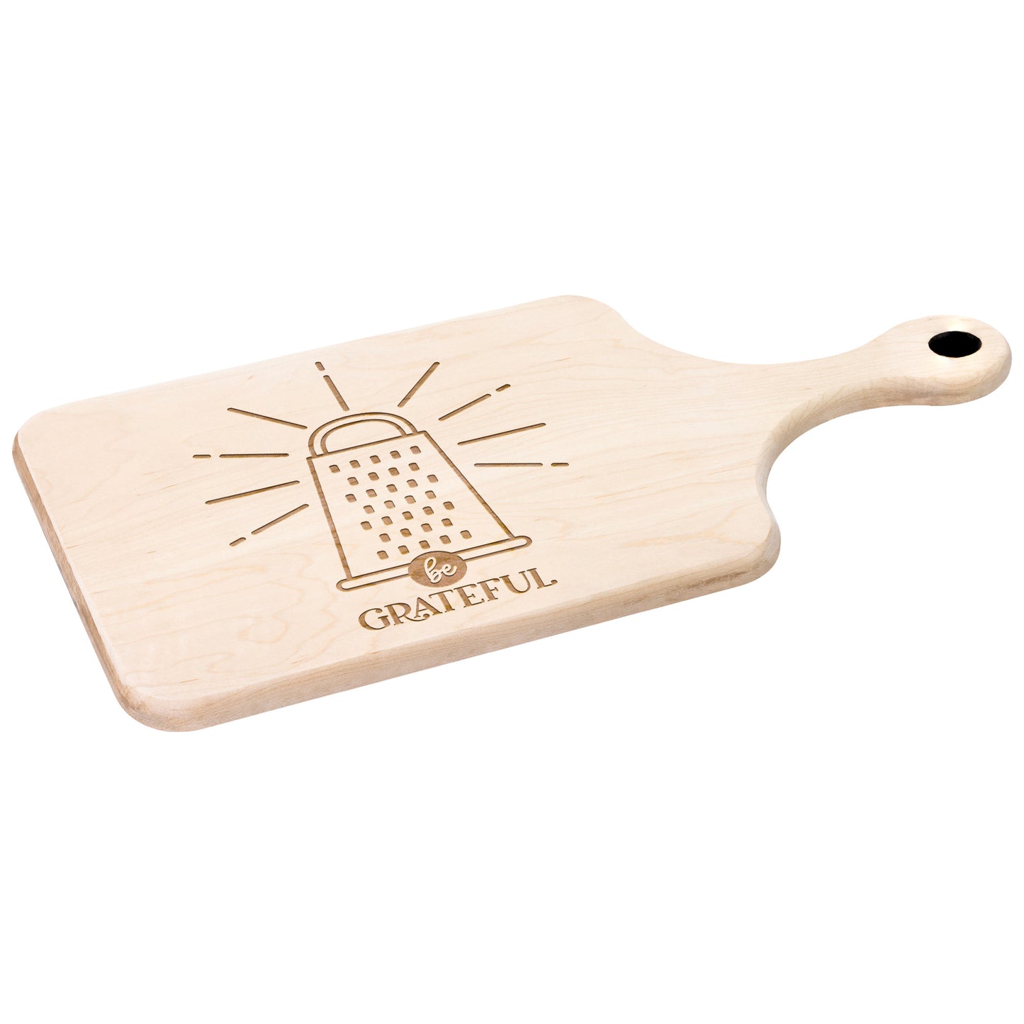 a maple cutting board with a cheese grater with the words "be grateful" engraved on the cutting board on white background