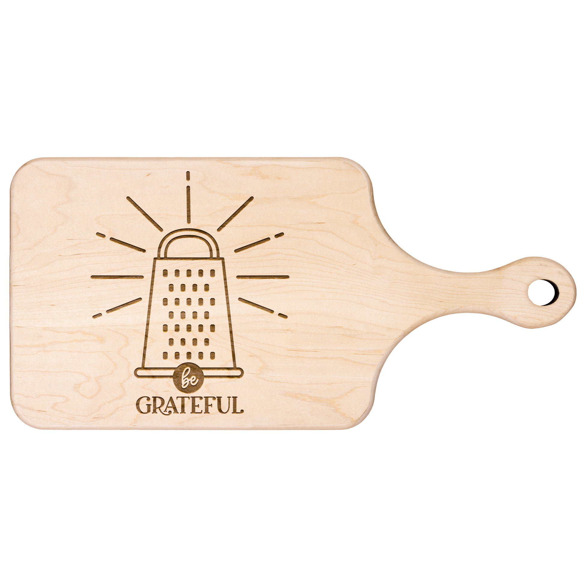 a maple cutting board with a cheese grater with the words "be grateful" engraved on the cutting board on a white background