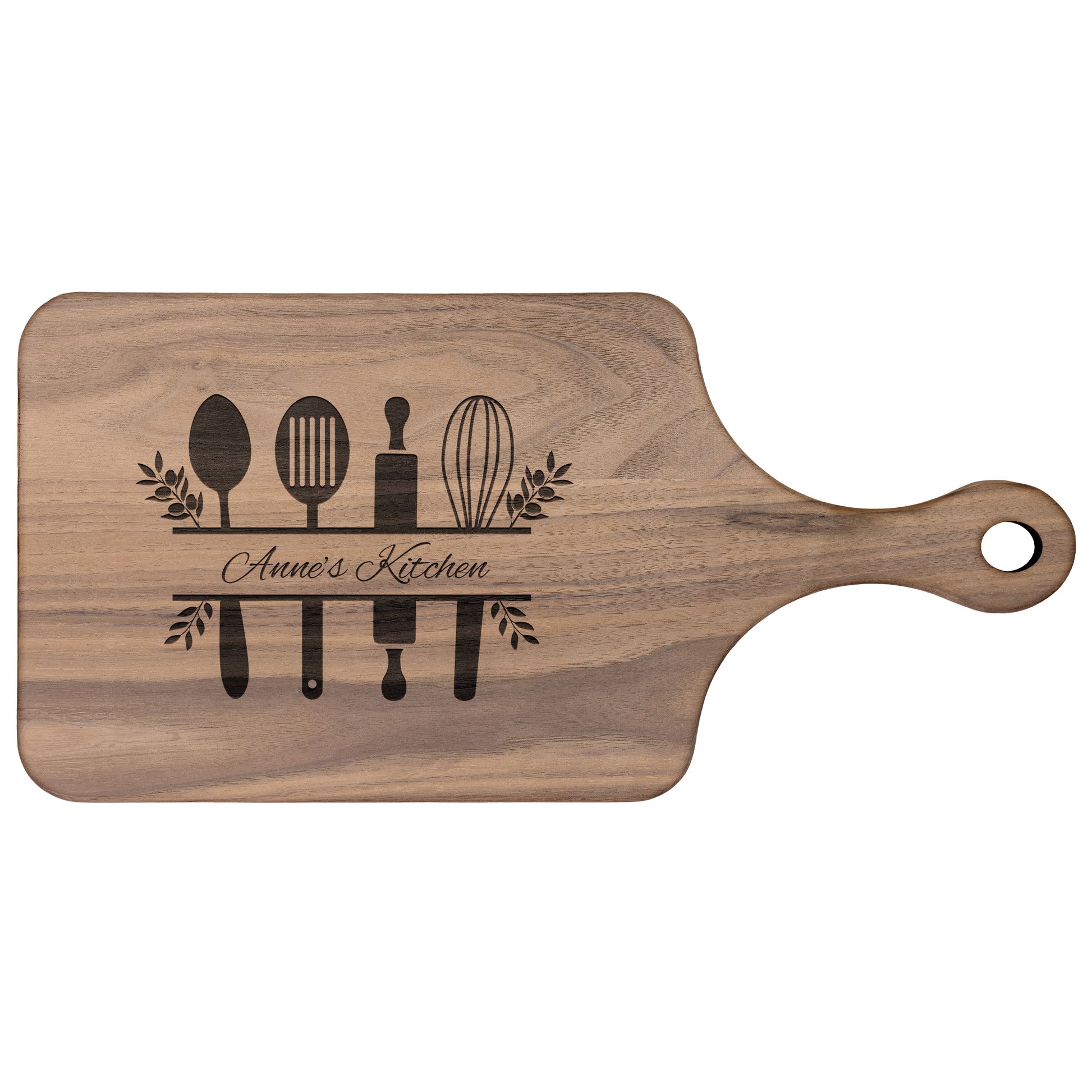 view of a personalized walnut paddle cutting board on a white background