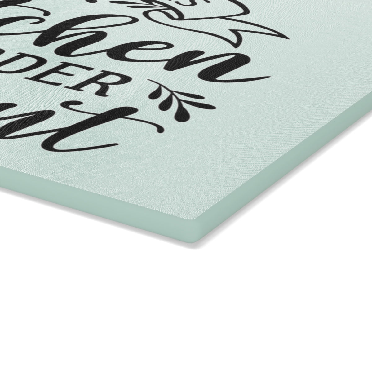 close up view of the corner of a glass cutting board